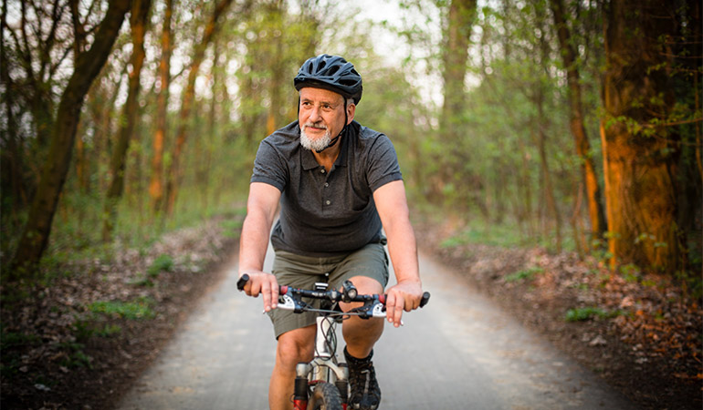 A person bicycles on a path.